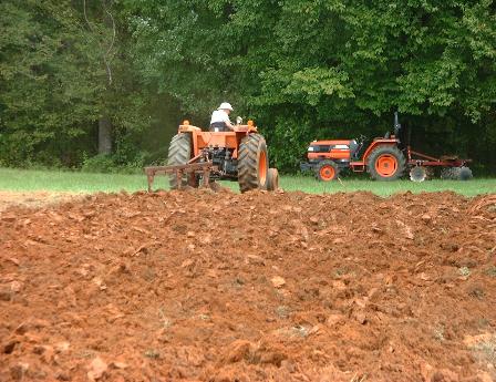 Uncle Joe getting CSA field ready. Tractors are converting to bio-diesel.