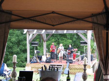 Eddie McBride and his band from inside winery tent of Stonefield Cellars