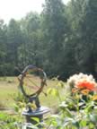 Momma's creamtory urn- angels and the stars in the rose garden- her favorit place to sit was on my front porch and look out at the medley meadow. (117kb)