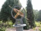 Pretty angels with the armillary pointing to the north star. It keeps perfect time. (122kb)