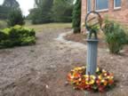 Silk seasonal wreaths will be put around the base each season. Also, a 12 inch granite base is being made with 